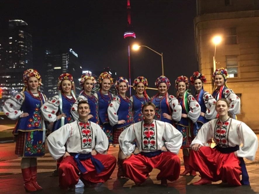 Desna Ukrainian dance company wearing traditional Ukrainian clothes: red boots, embroidered shirts, flower crowns for girls and wide pants for guys.