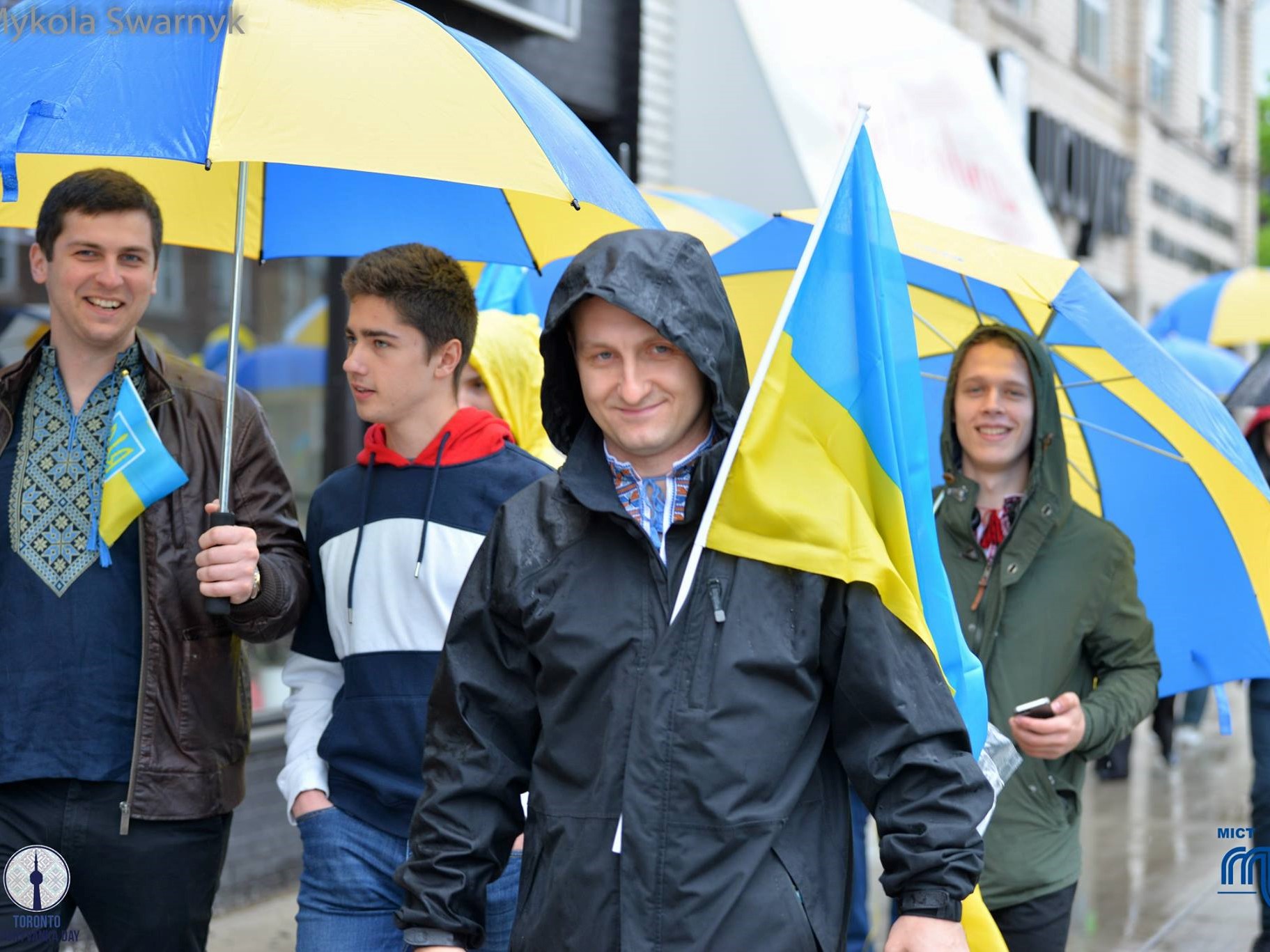 Parade down the Bloor West Village with Ukrainian flags, IKEA (blue-and-yellow) umbrellas and music