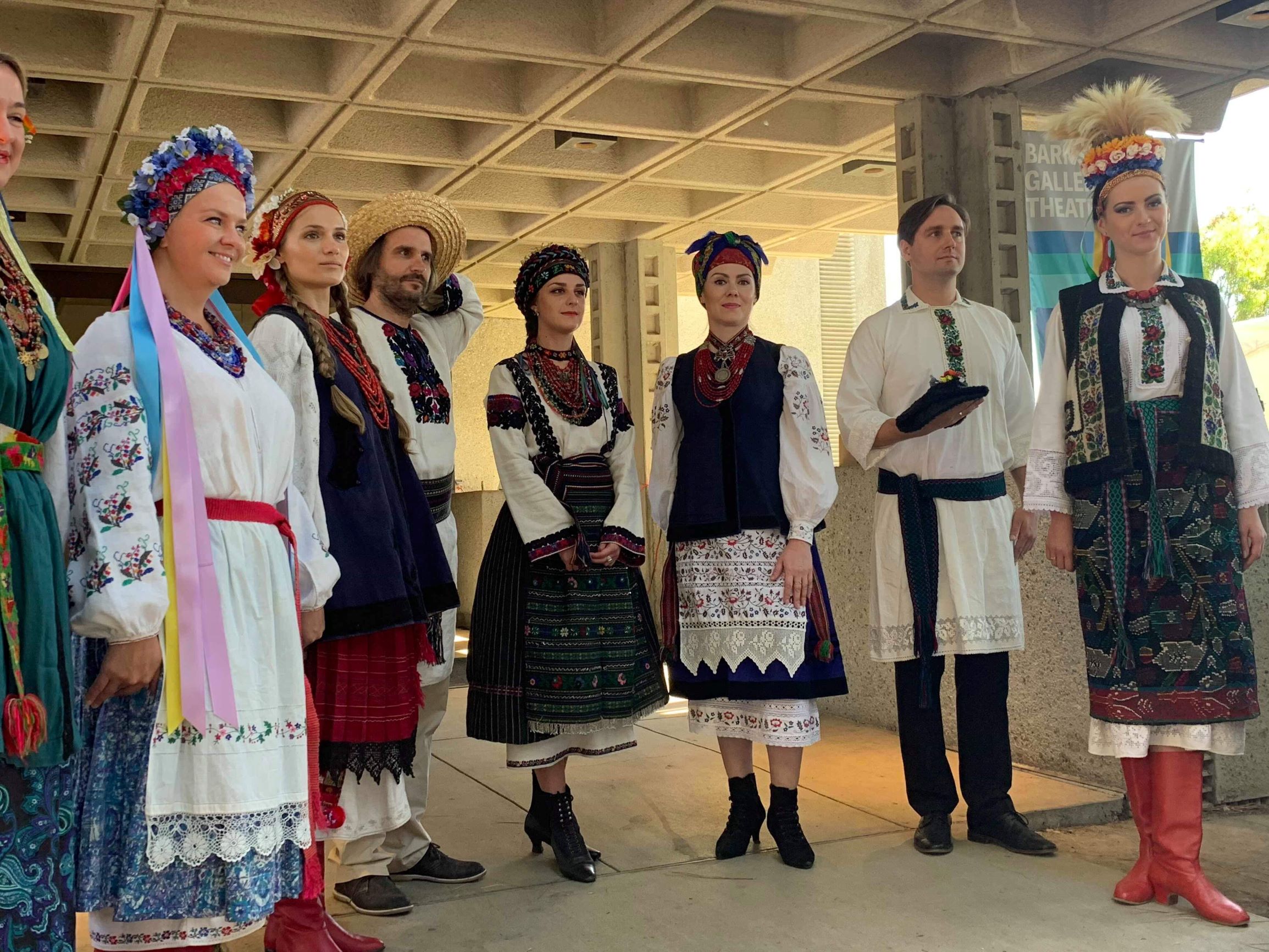 Models wearing traditional Ukrainian clothes from different regions.